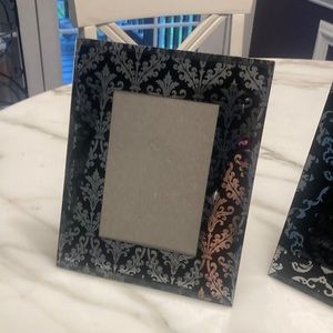 Two decorative picture frames.